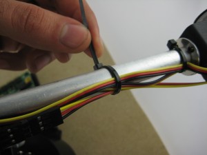 Attaching the Sharp sensor cables to the arm