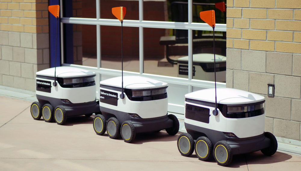 Delivery Robots Parked Beside Glass Window