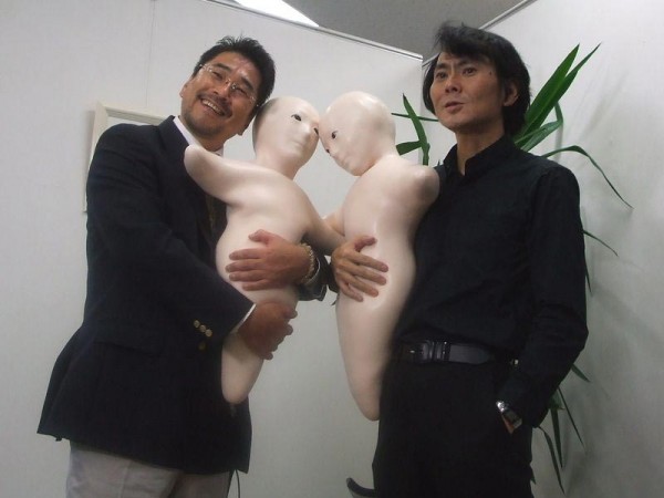 Prof. Hiroshi Ishiguro On the Right Holding Ghoulish Robot