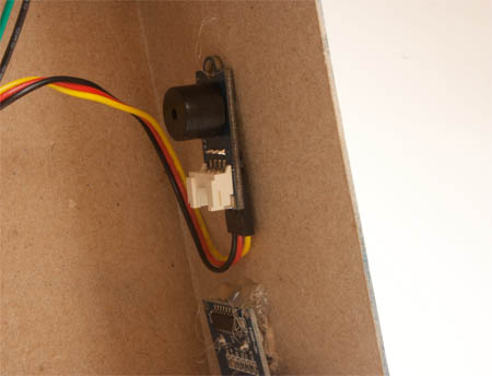 Electronic Brick Buzzer taped to the inside front of the Desktop Pal enclosure