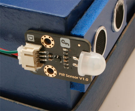 Passive infrared detector module attached to side of the Desktop Pal