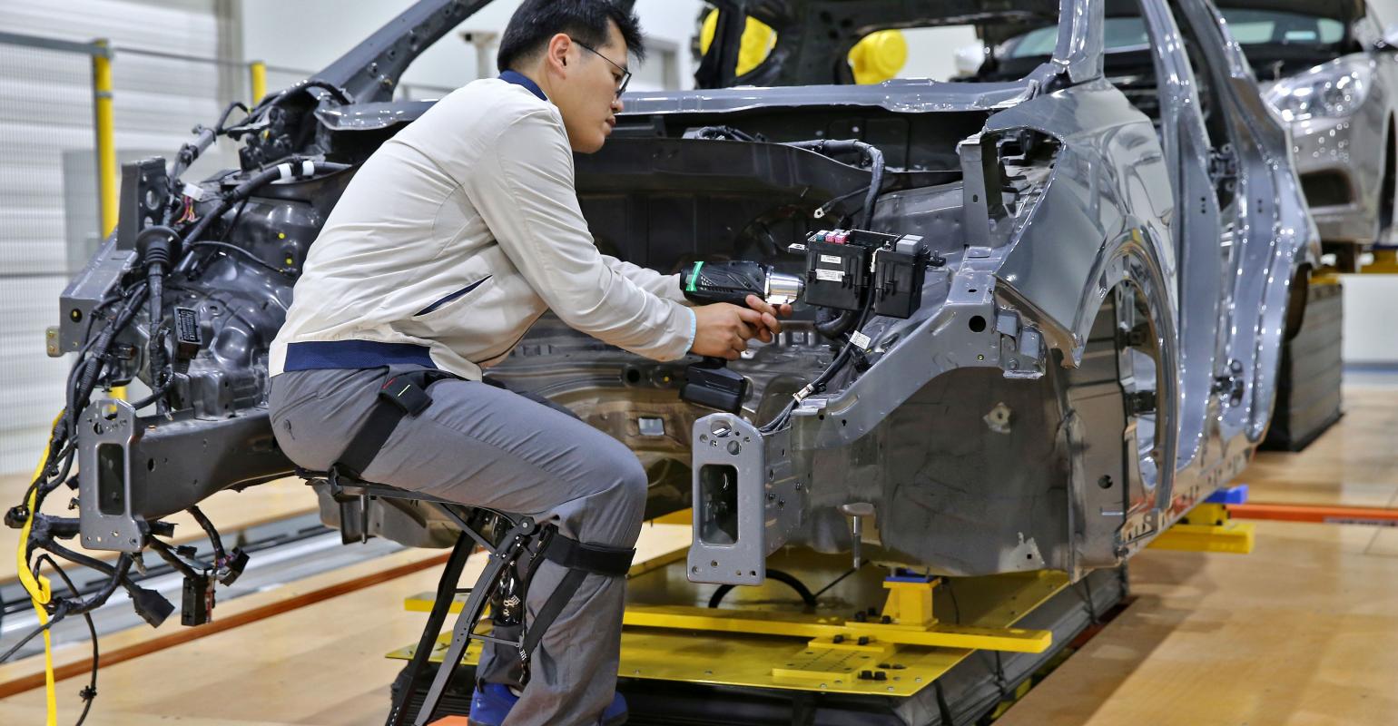 Hyundai’s Chairless Exoskeleton helps maintain worker’s sitting position.