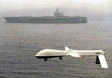 Predator Drone with Aircraft Carrier in background